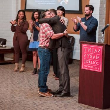 Hugs at the Scholars Reception