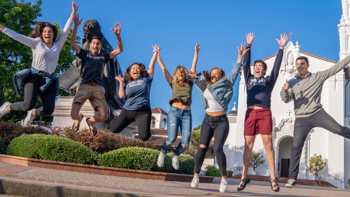 Saint Mary's Students Jumping in front of Chapel